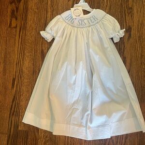 Brand new with tags. Big sister smocked dress.